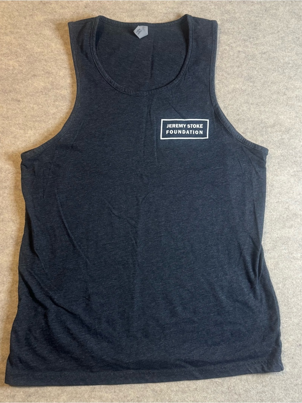 Next Level Apparel Black Tank Top with Jeremy Stoke Foundation Logo